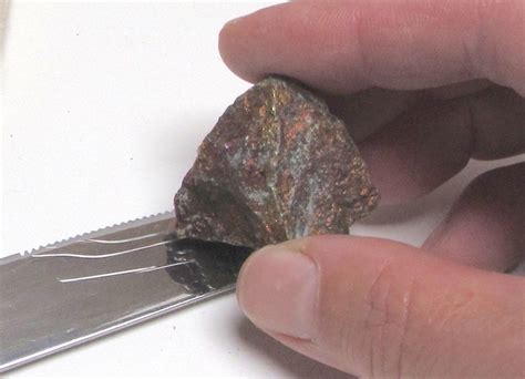 testing rock hardness with a knife|copper mineral hardness test.